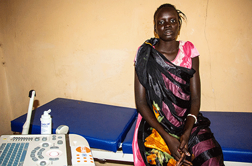 Woman sits in maternity ward