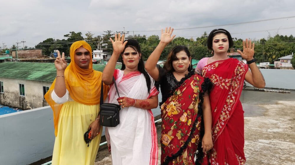 A Hijra community pose for a photo.