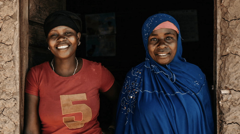 Two women smiling. 