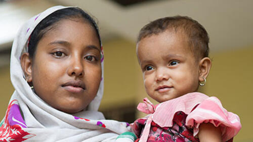 Rahae Na Bagum, 19, holds her 18-month-old baby at Dai Pai Hospital in Rakhine State, in September 2013, before humanitarian staff were evacuated following attacks in March 2014. Photo credit: UNFPA Myanmar